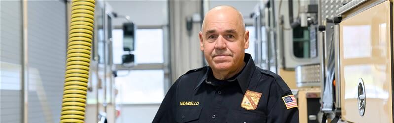 Fireman John Lucariello holding his hat