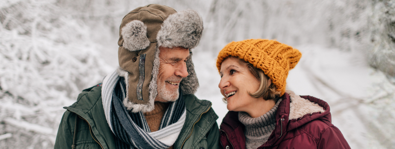 Couple staring at each other with winter setting