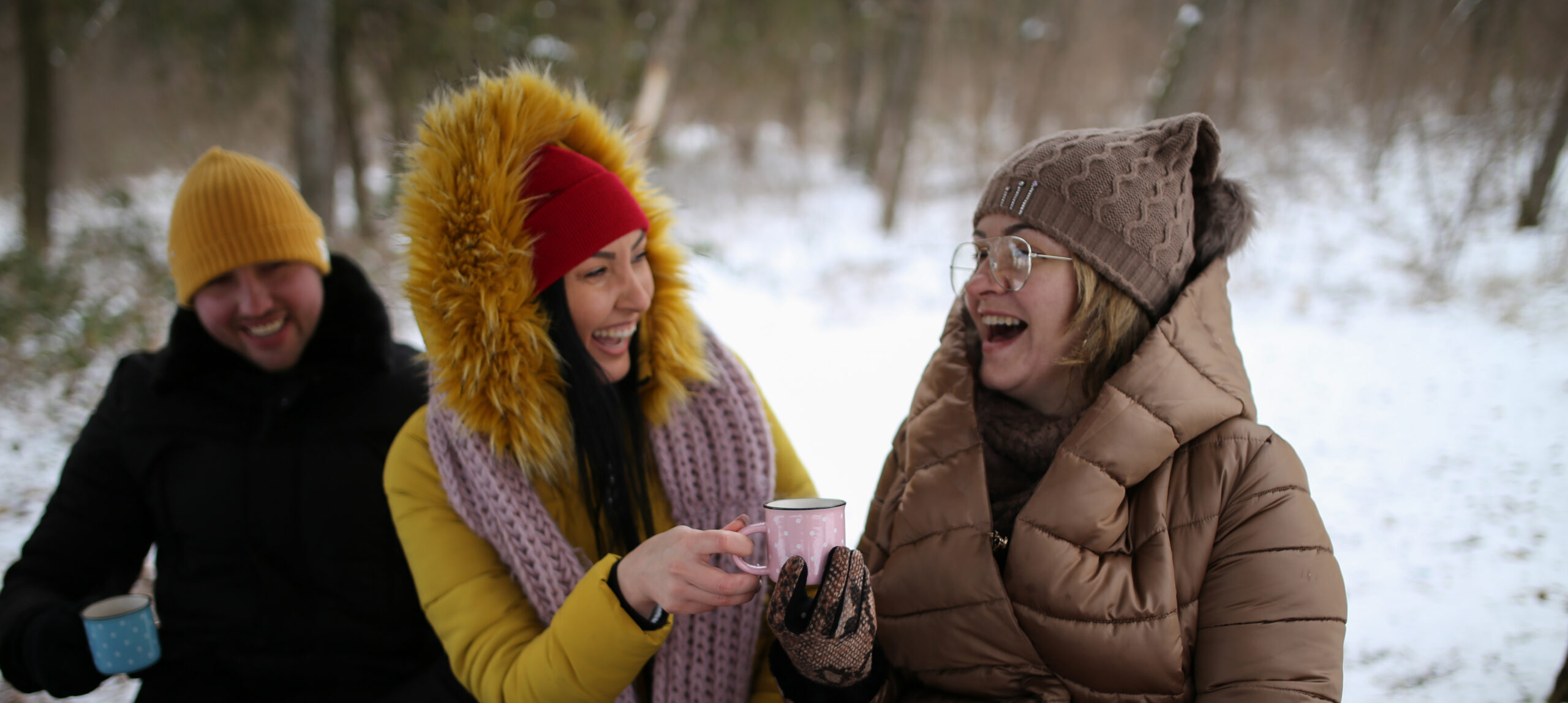 Cold Weather, Warm Hearts: Protecting Your Heart in Winter Small group of friends drinking coffee on snow in forest
