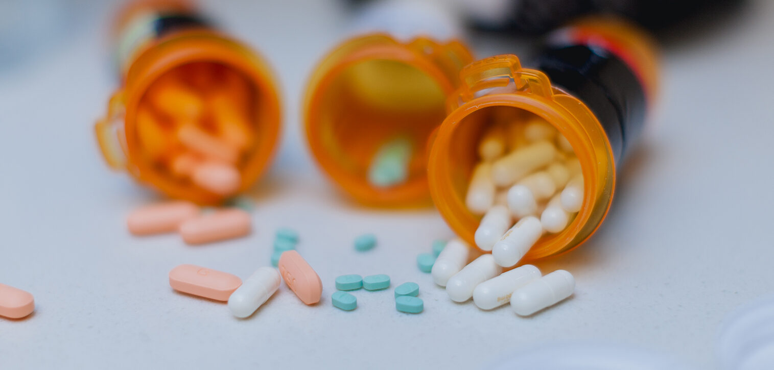Open Pill Bottle on Kitchen Counter