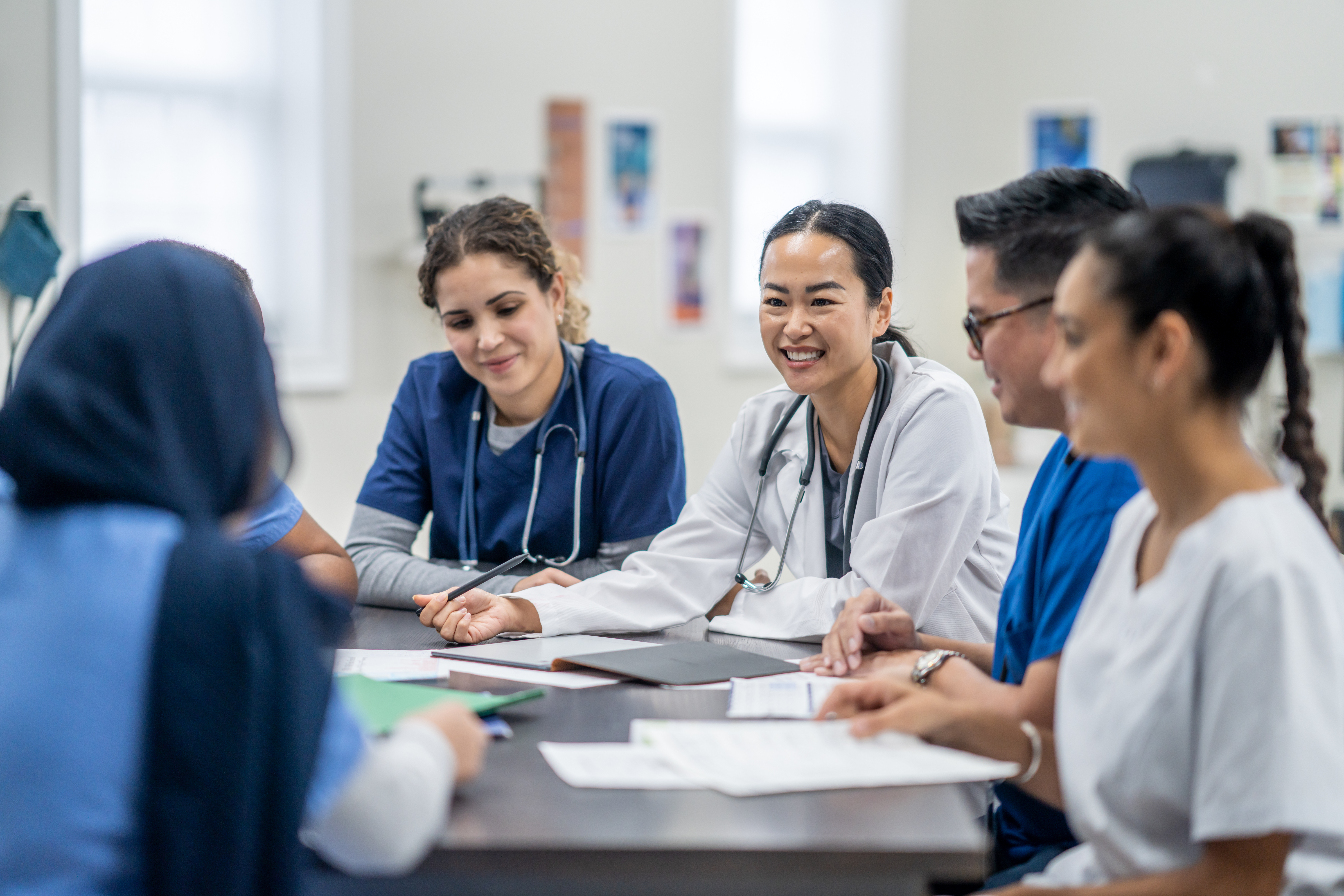 Doctors and residents reviewing charts