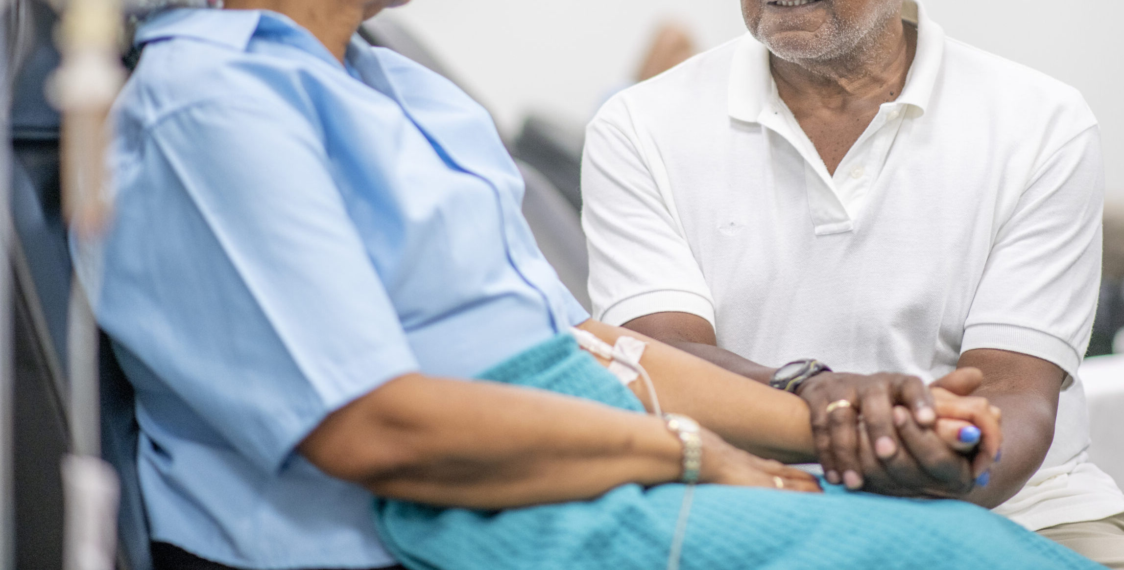 Senior adult woman in the oncology unit receiving chemotherapy treatment.