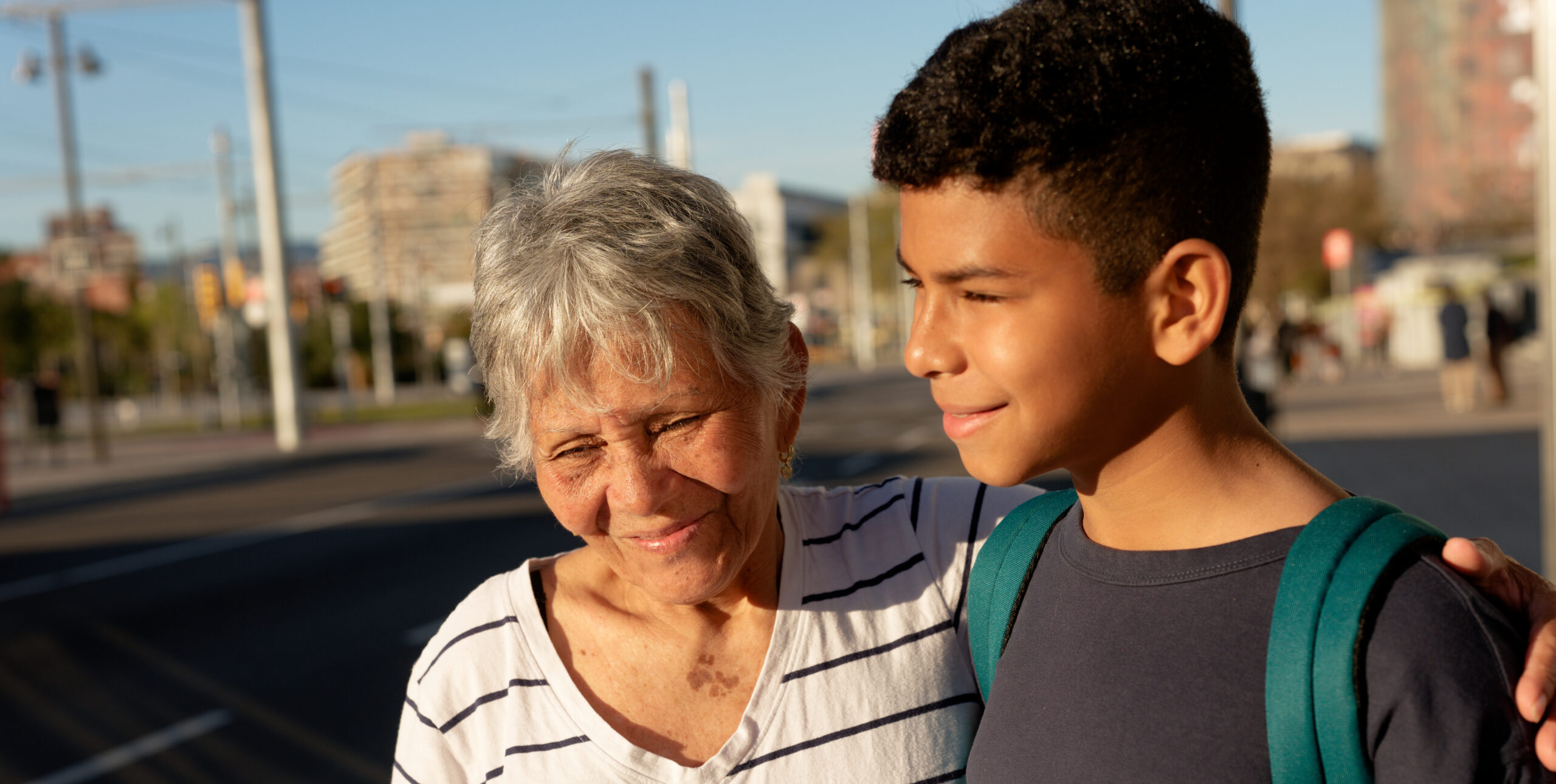 Recognizing Anxiety and Depression in School-Age Kids Grandmother, a mature adult, walking with her grandson, an elementary age boy, enjoying time outdoors together in a city environment
