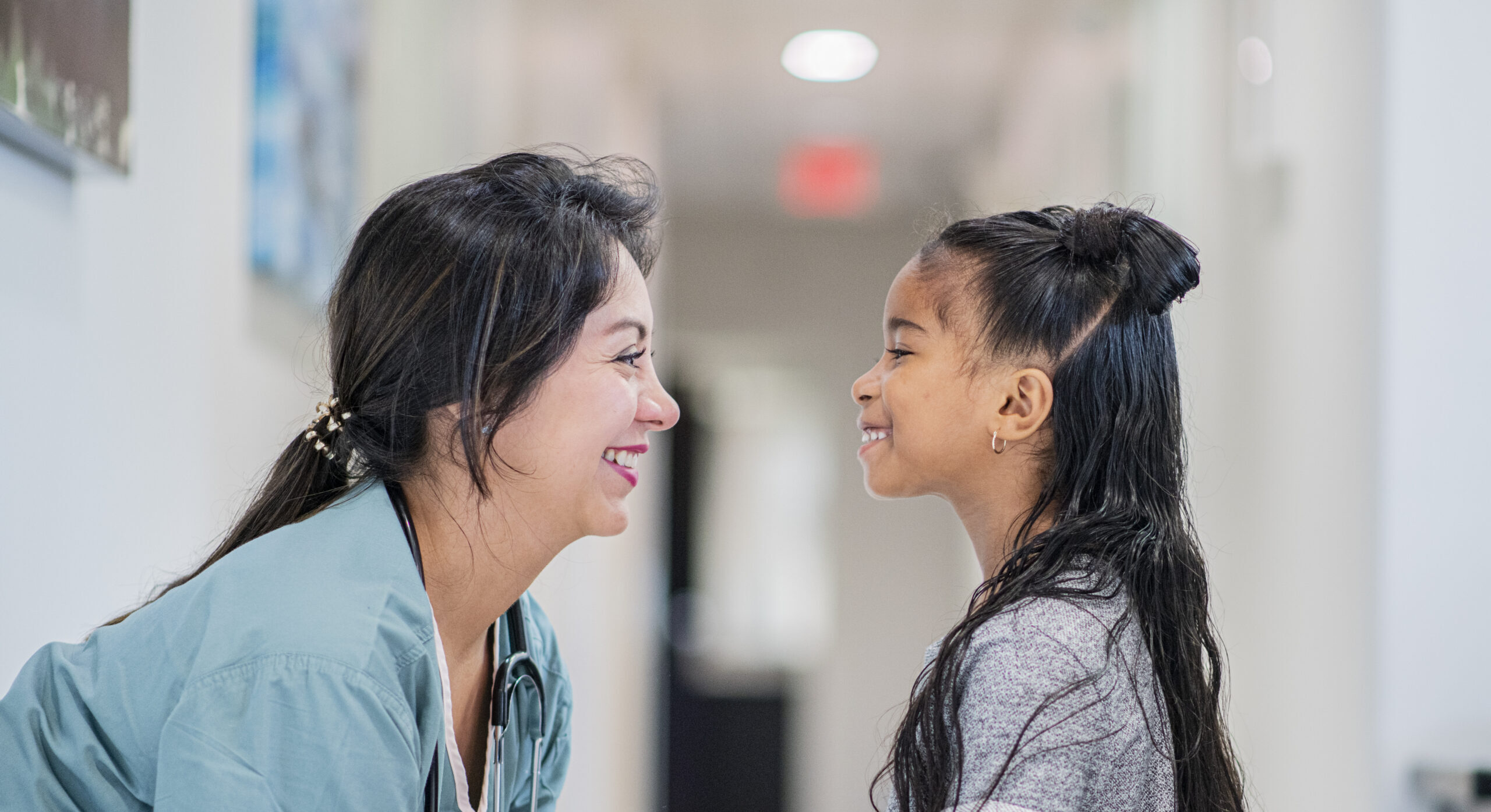What Families Should Know About Childhood Cancer Doctor Talking to a Little Girl stock photo