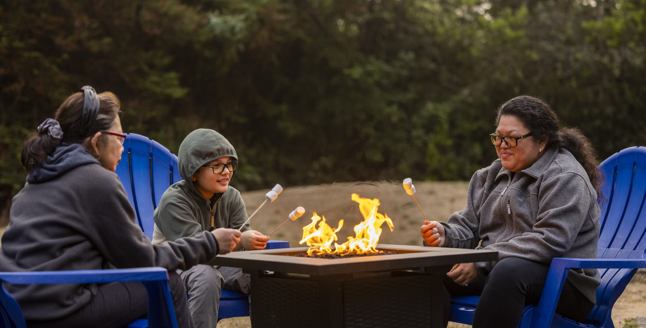 Taking Care of Your Mental Health as the Days Get Shorter Cooking S'mores by a Fire Pit