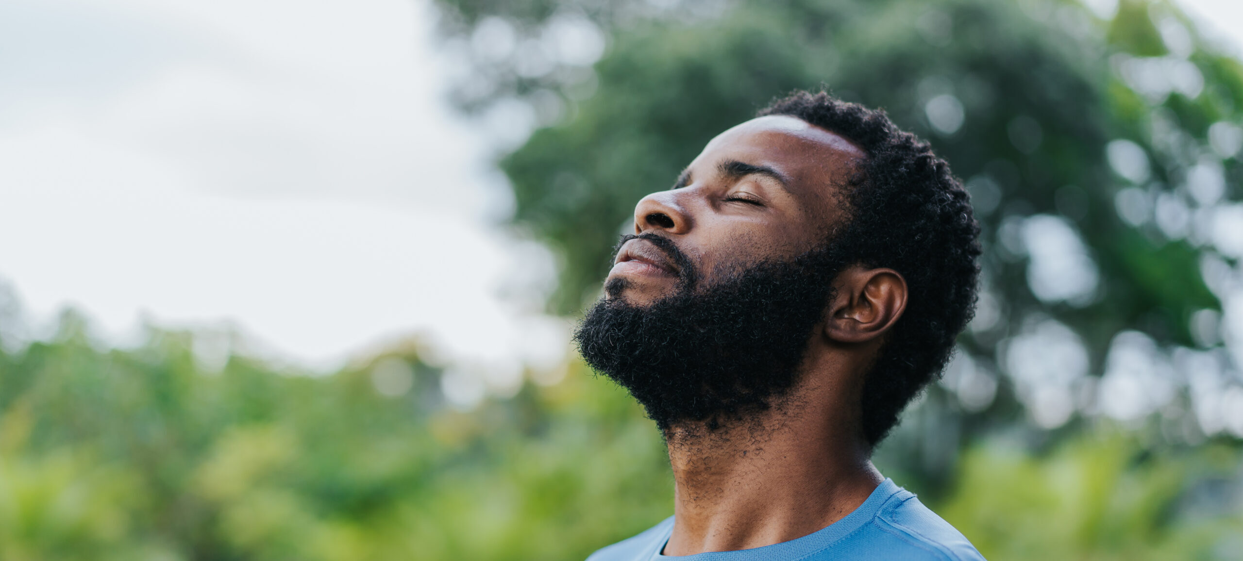 Portrait of a man breathing fresh air in natur